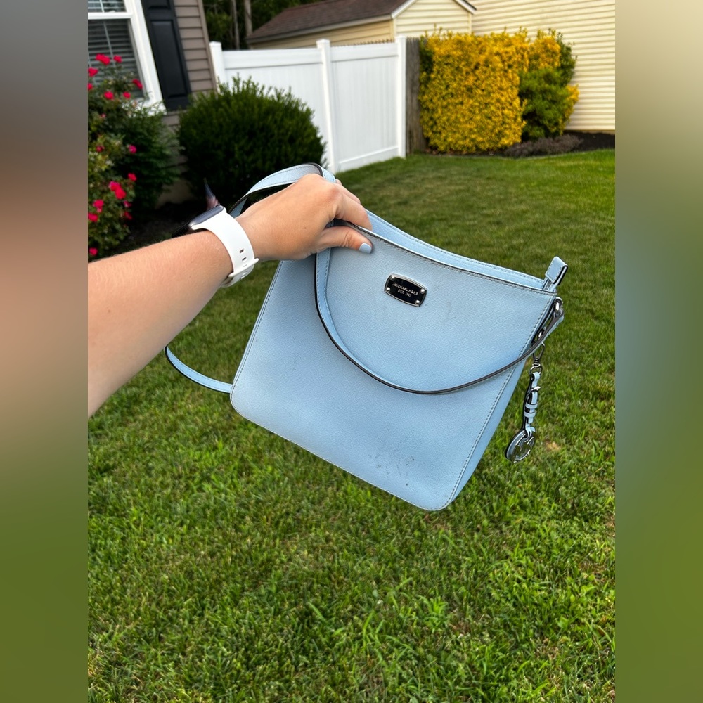 MICHAEL KORS blue cross body bag with matching wallet.